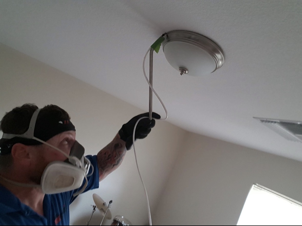 Respirator-protected interior pest treatment
